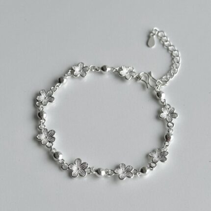 Silver Blossom Charm Bracelet with Beaded Accents